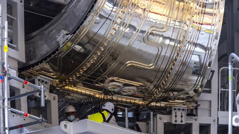 A total of approximately 23 kilometres of piping are welded to the surface of the thermal shield panels. An example of the piping on a vacuum vessel thermal shield panel is clearly visible in this photo, which shows a vacuum vessel module in pre-assembly tooling. (Click to view larger version...)